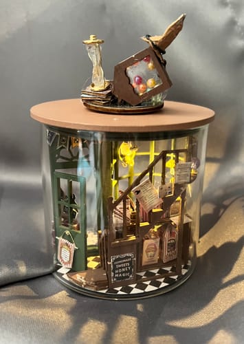 Customer's completed 3D Puzzle Shop Craft Kit inside a glass jar, showing the detailed interior.