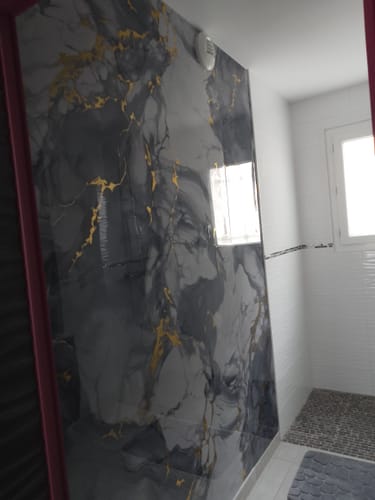 Customer photo review of Panneau Mural PVC Effet Marbre Mystic Bleu Doré - Salle de bain ou Douche