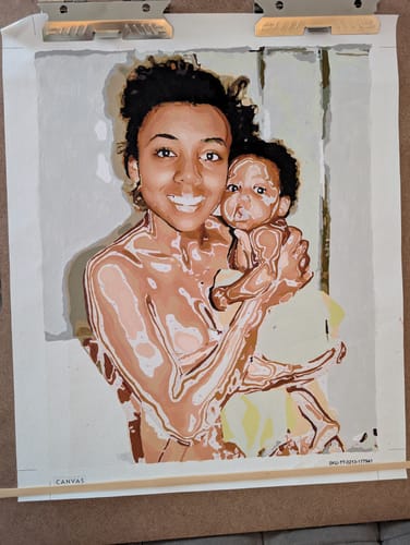 Customer's in-progress custom paint by numbers artwork showing a smiling person holding a baby.