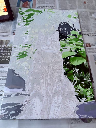 Customer's in-progress custom paint-by-numbers kit of a cat. The background is partially filled in with green paint.