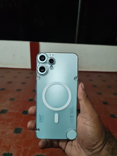 Customer holding a Nothing (CMF 2 PRO) phone in the clear Anti Yellow Magsafe Transparent Case, showing the back.