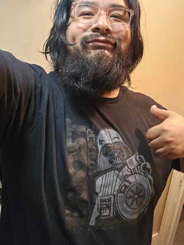 Reviewer wearing the black BoostForce Shirt, showing the Darth Vader turbo graphic while giving a thumbs-up.