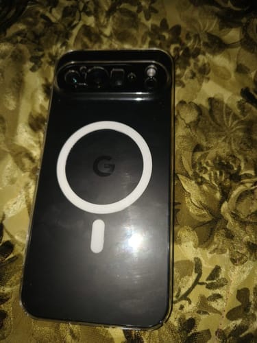 Customer's Anti Yellow Magsafe Clear Case on a black Google Pixel phone, showing the back with the white MagSafe ring.