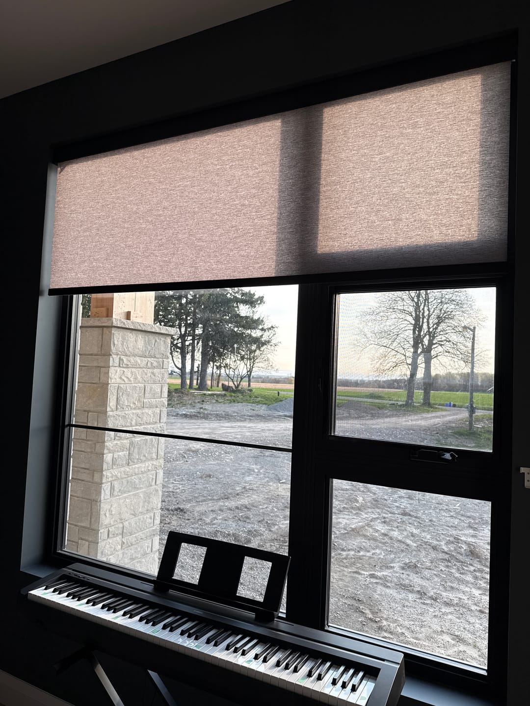 Customer photo review of SmartWings Motorized Light Filtering Roller Shades 70% Blackout Safari