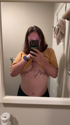 Reviewer shows a large, new sternum tattoo after using Painless Tattoo Numbing Cream.