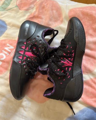 Customer's pair of Joker 2 'Duality' shoes in black with bright pink accents, viewed from above.