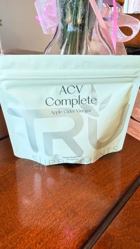 Customer shows the new white pouch packaging for their ACV Complete supplements.