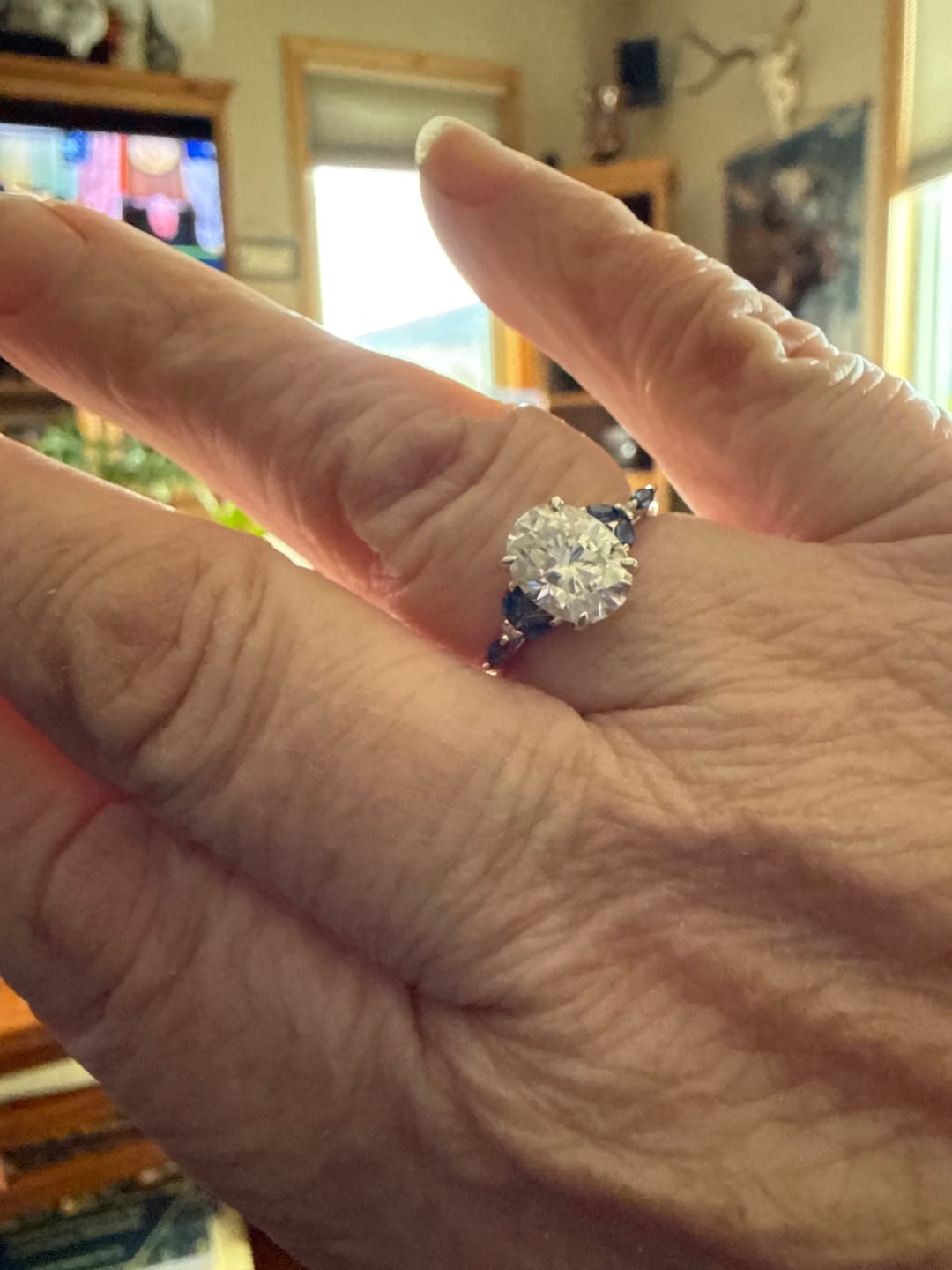 Customer photo review of Oval Cut Moissanite With Marquise Sapphire Petals Accents Engagement Ring