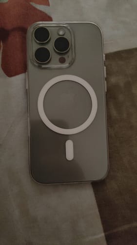 Customer's iPhone in the Anti Yellow Magsafe Clear Case, showing the transparent back and white MagSafe ring.