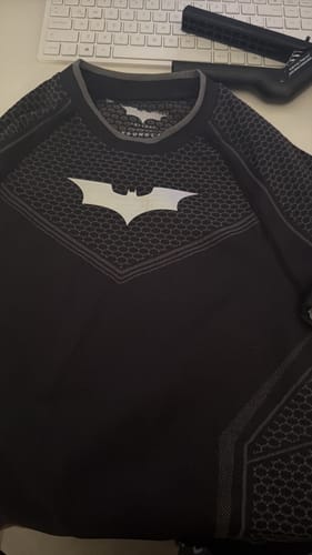 Customer's Batman Compression Longsleeves laid flat, showing the textured knit pattern and white logo.