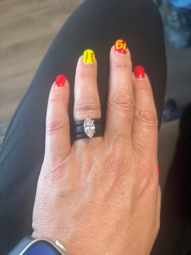 Customer's hand wearing the black Marquise Cut CZ Silicone Ring Set, showing the stacked bands and center stone.