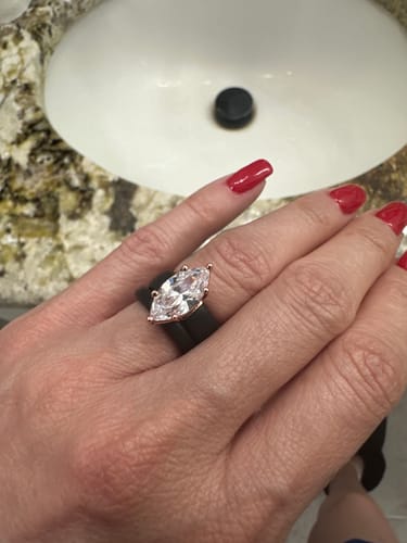 A customer wearing the Marquise Cut CZ Silicone Ring with its black band and large stone.