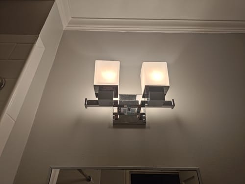 Customer's bathroom vanity light with two G9 Halogen bulbs installed, casting a warm, pleasant glow.