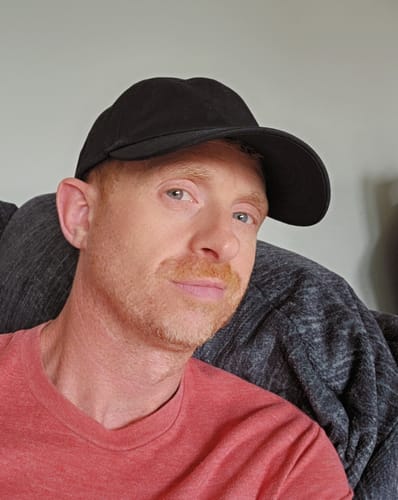 Reviewer taking a selfie while wearing the black 80Eighty® Dad Hat.