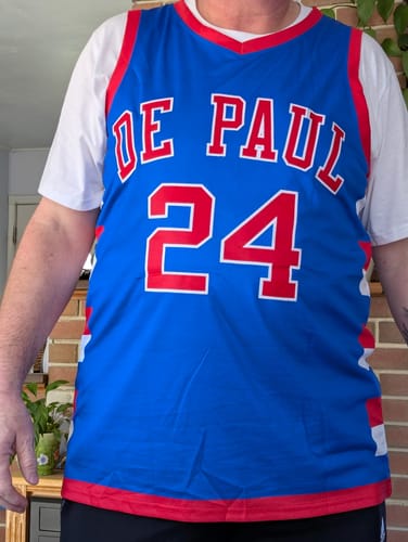 Customer wearing the front of a custom blue and red basketball jersey with "DE PAUL" and the number "24".