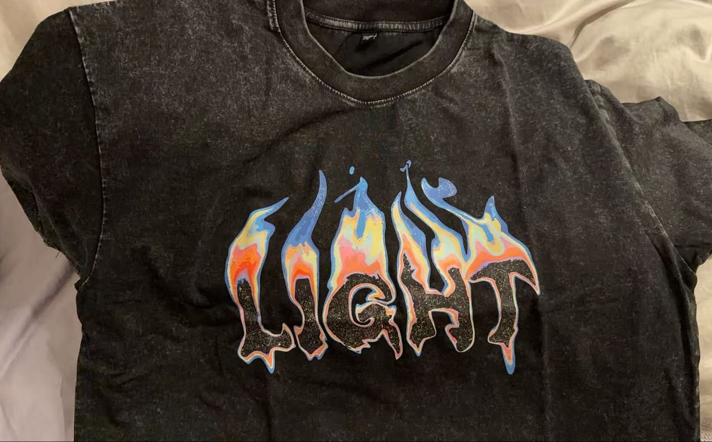 Customer photo review of Be The Light Flame Graphic Tee
