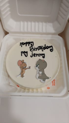 Customer's Tom n Jerry Cartoon Cake in a box, with a custom 'Happy Birthday My Jerry' message in black icing.