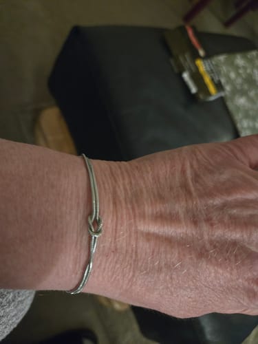 Customer showing the Forever Knot Bracelet worn on their wrist.