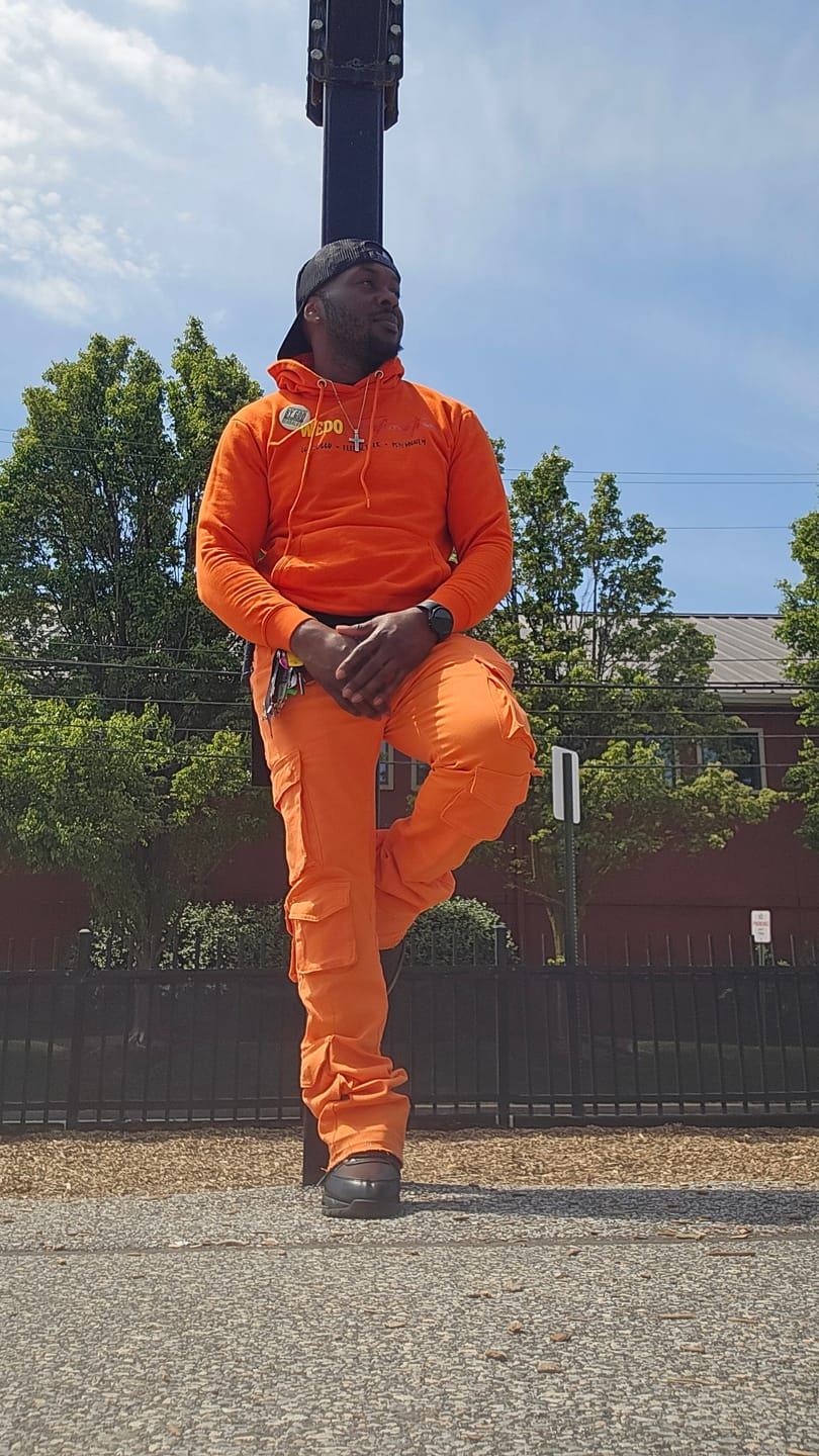Customer photo review of Air Jordan 4 "Drip Harder" Tee (Metallic Orange)