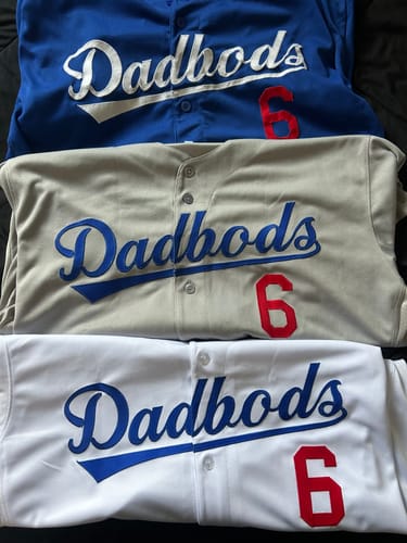 Reviewer's three custom baseball jerseys in blue, grey, and white, each with "Dadbods" and the number 6.