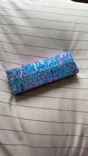Customer's closed Weekly AM-PM Vitamin Case 2.0 with a colorful blue and pink pattern.