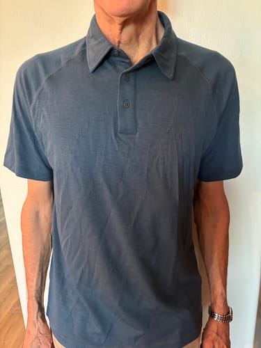 Customer wearing the Summit Polo in the Starry Night color, showing the fit and neat collar.