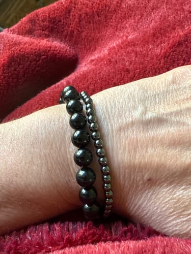 Customer wearing The Good Riddance Black Tourmaline Bracelet, showing its perfect fit on the wrist.