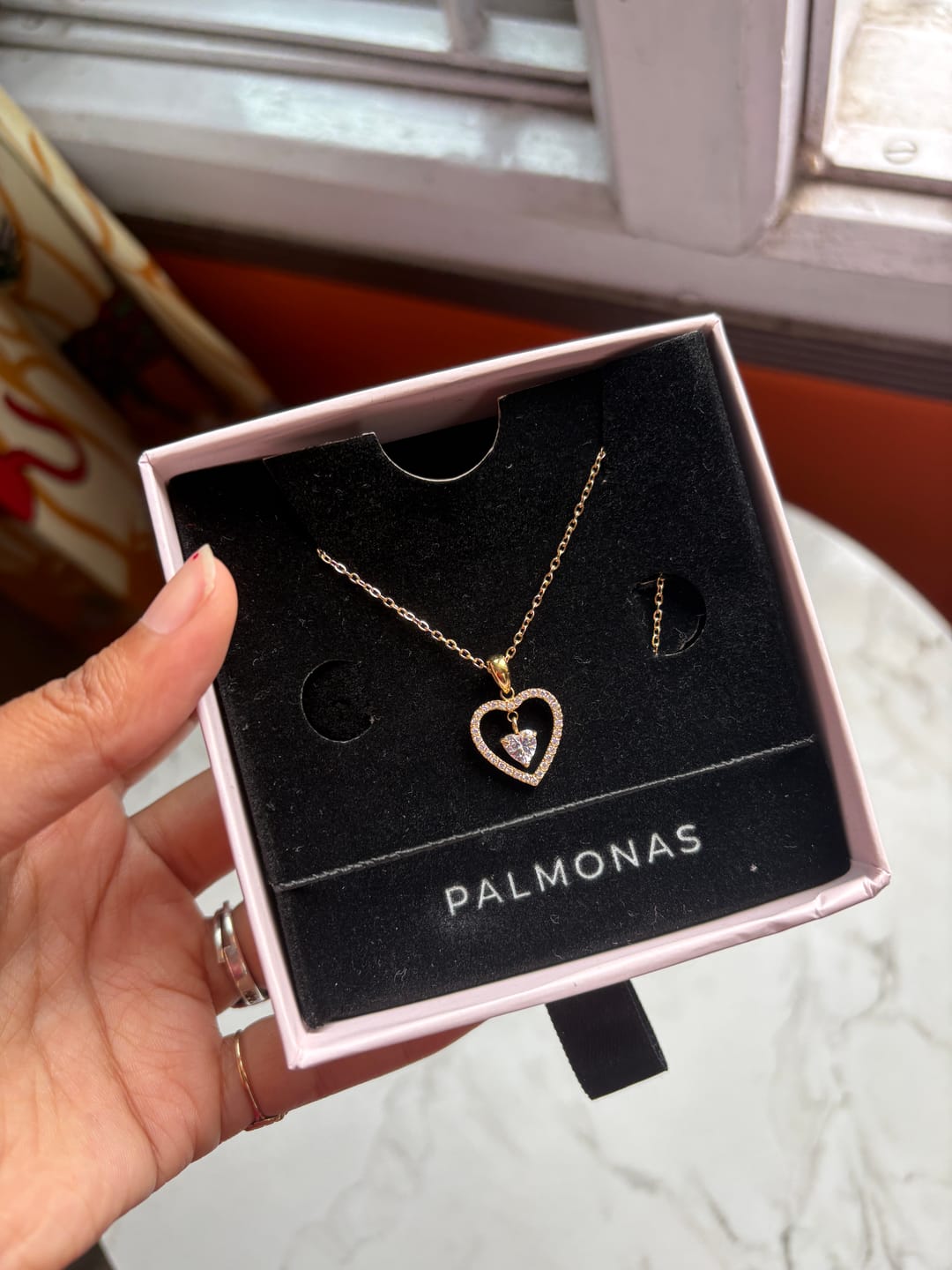 Customer photo review of Glitz Knot Halo Heart Pendant Necklace