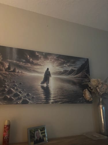 Reviewer's Walking on Water - Faith Wall Art II hanging on a wall in their bedroom, above a dresser.