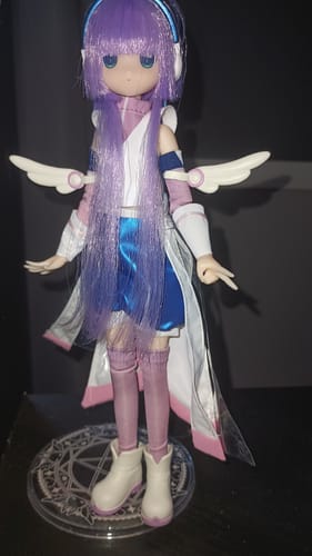 Customer's BJD action figure with long purple hair and headphones, displayed on a clear circular stand.