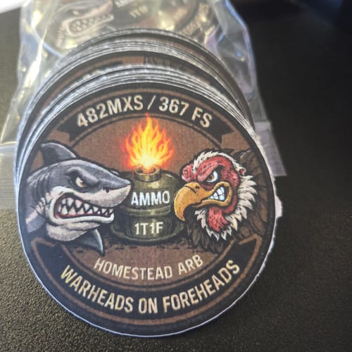 Customer's stack of custom circular stickers with a detailed military cartoon design.
