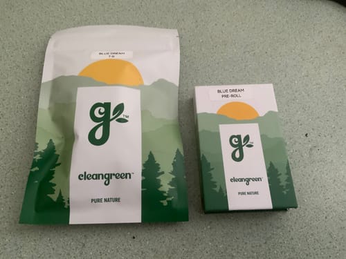 Reviewer's Blue Dream packaging, showing a pouch and a pre-roll box.