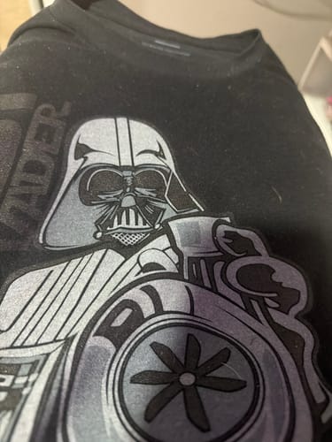 Close-up of a customer's black BoostForce Shirt with a detailed graphic of Darth Vader holding a turbocharger.
