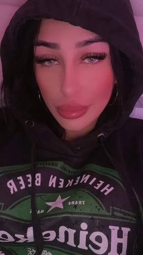 Close-up of a reviewer wearing the light-colored 3-Month Lenses with a black hoodie.