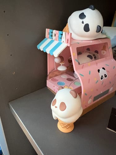 Customer's Panda Roll Shopping Street Series toy showing the pink ice cream truck with panda figures on a shelf.