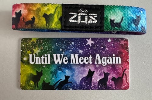 Customer's 'Until We Meet Again' Cat Bracelet with a colorful galaxy design and cat silhouettes, shown with its matching card.