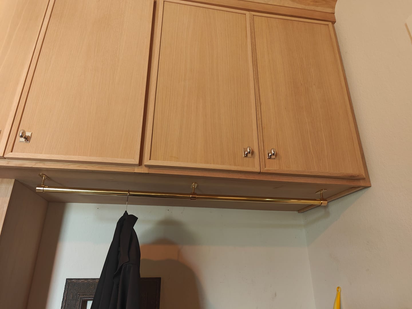 Customer photo review of Closet Rod – Unlacquered Polished Brass