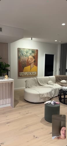 Reviewer's Palmeras Framed Canvas Art Print hanging as a centerpiece on a living room wall.