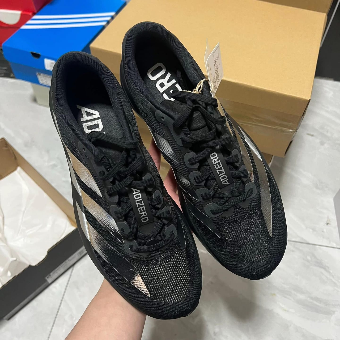 Customer photo review of Adizero Evo SL CoreBlack / Iron Mettalic