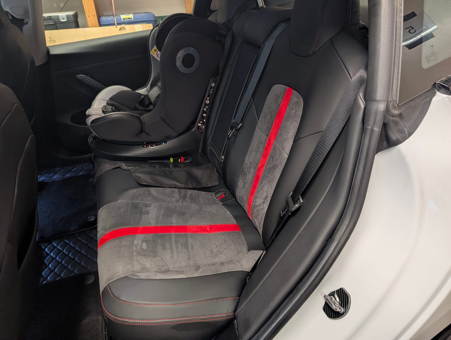 Customer photo review of Alcantara All-Inclusive Seat Covers for Tesla Model 3 (2018-2025+) / Model Y (2021-2025+) (Luxury Red Stitching Design)