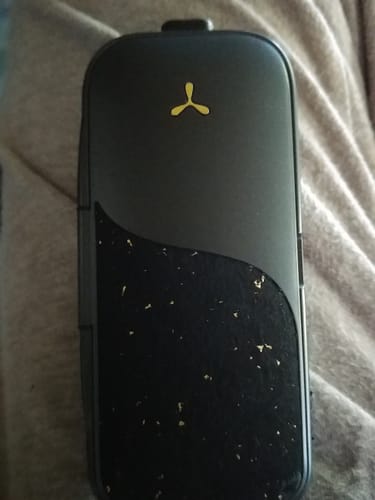 Customer's black LEGACY PRO 2 vaporizer, showing the distinctive gold-flecked cork fabric section.