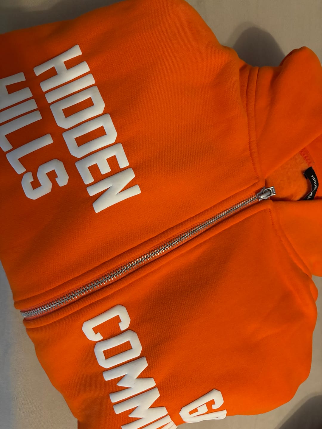 Customer photo review of GATED COMMUNITY ZIP HOODIE ORANGE