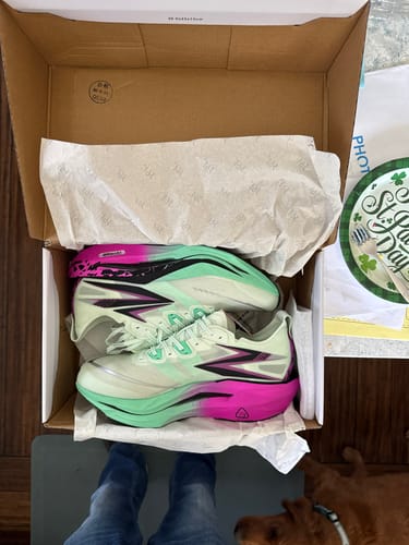Customer's new Flame 5 "Apex" running shoes in mint and pink, viewed from above in the open box.