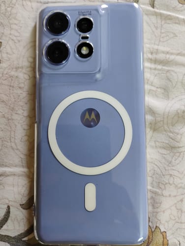 Customer's Anti Yellow Magsafe Clear Case on a purple Motorola phone, seen vertically on a patterned surface.