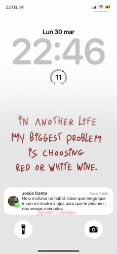 Customer's phone lock screen showing a white wallpaper with red, handwritten-style text.