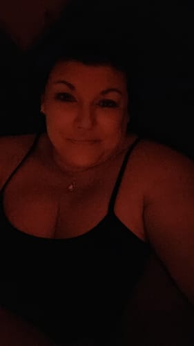 Customer photo review of Love Knot Round Moissanite Necklace in Sterling Silver