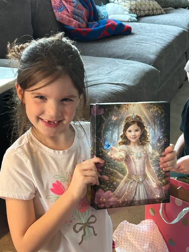 A smiling young customer proudly holding her personalized 'The Woodland Princess' canvas portrait.