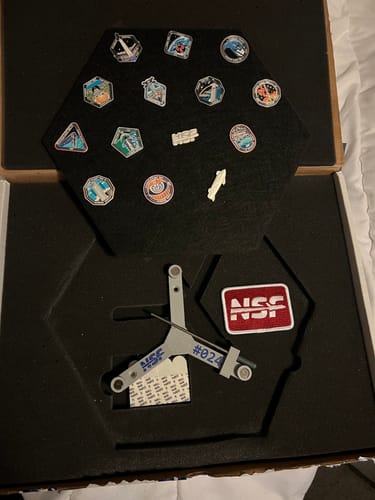Customer's unboxed SpaceX Starship Flight Pin Collection showing the pin display board and the serialized #024 mounting arm.