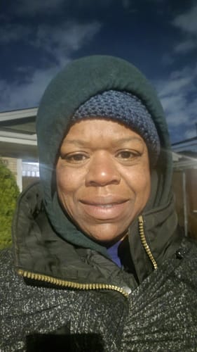 Customer's glowing face, looking hydrated after using the Turmeric Fade & Glow Bar.