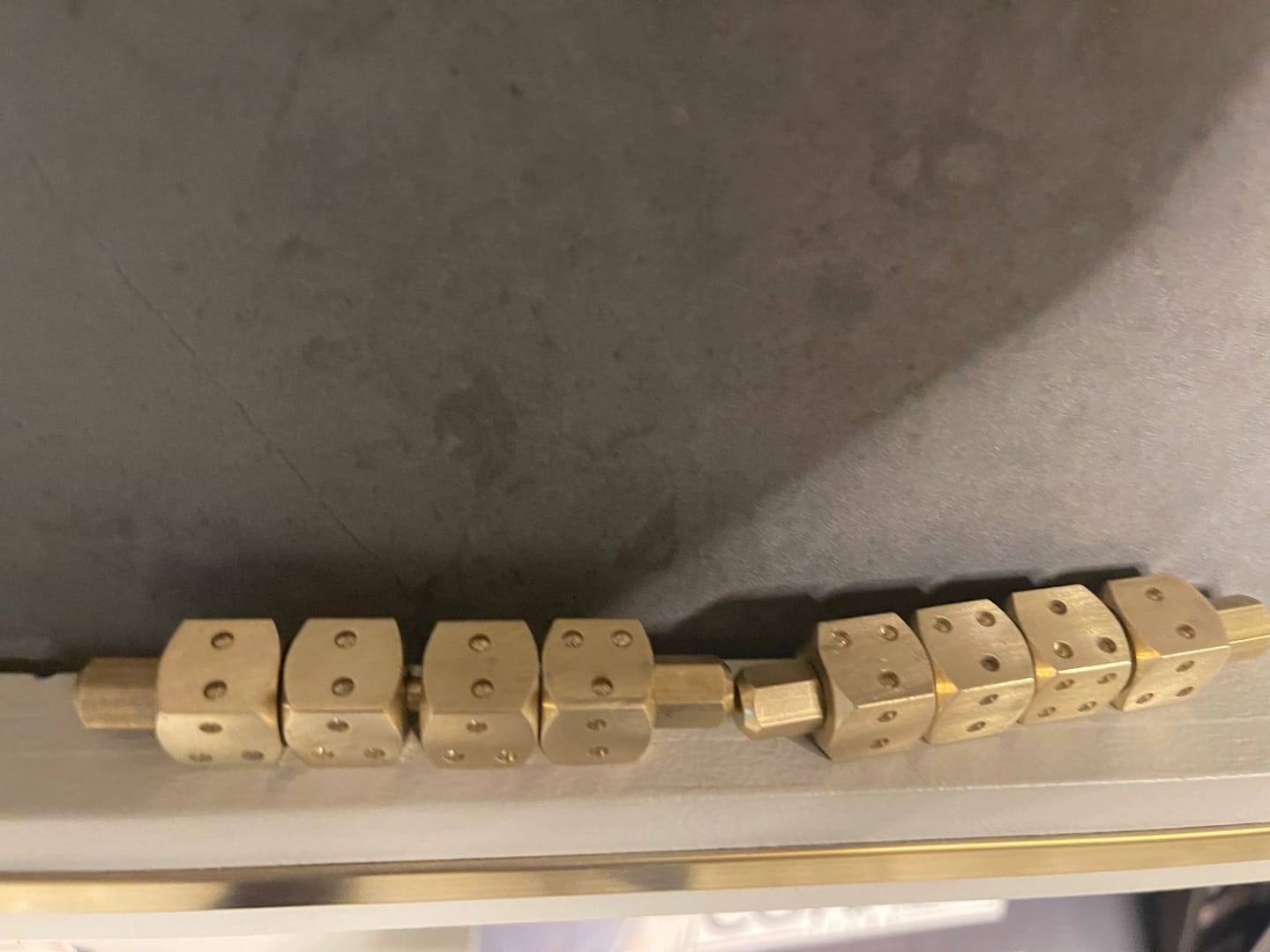 Customer photo review of Brass Ramal Pass Dice – Vastu Remedy for Divination & Spiritual Consulting | Ideal for Astrology Readings & Vastu Analysis | 8 cm x 1.4 cm x 1.4 cm | 200 g